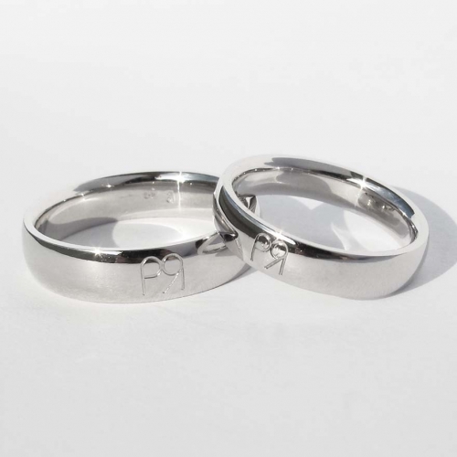 White gold weddings ring with engraving