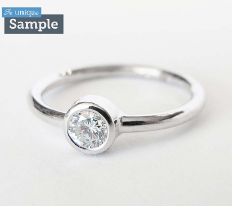 Minimal white gold engagement ring with diamond