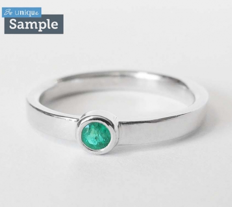 Minimal emerald engagement ring